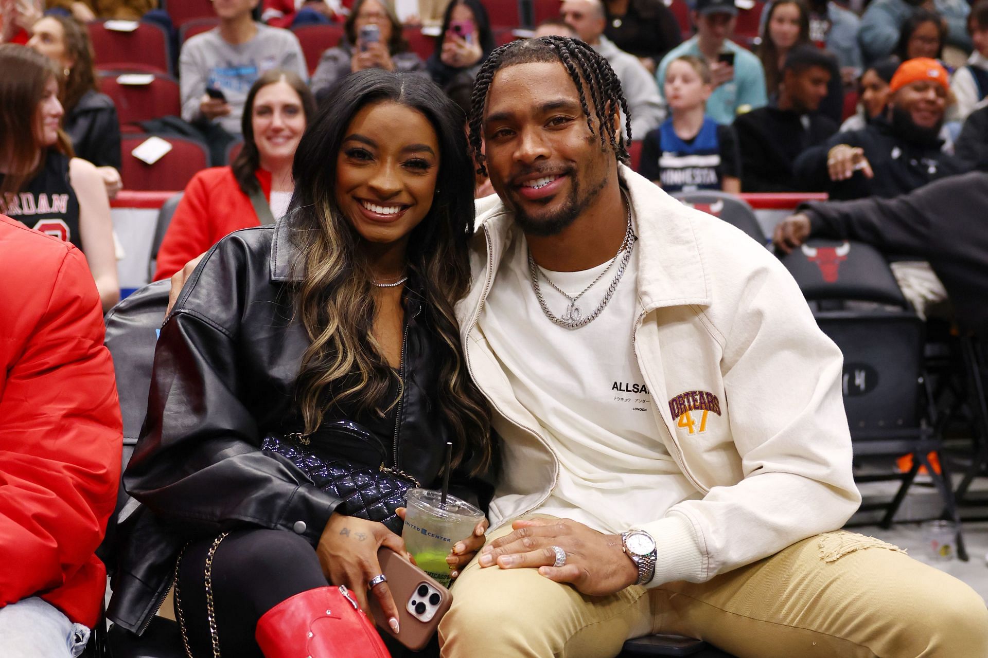 Simone Biles and Jonathan Owens during the Chicago Bulls and the Minnesota Timberwolves faceoff at the United Center in Chicago, Illinois. (Photo by Getty Images)